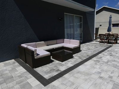 Paver patio with a dark border inlay, Tampa Bay, FL