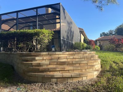 Curved block retaining wall with built-in steps, Tampa Bay, FL